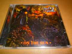 AXE STEELER - On the Run. CD